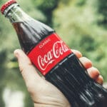 Hand holding Coca Cola